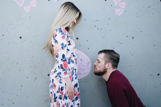 Pregnancy announcement with chalk belly