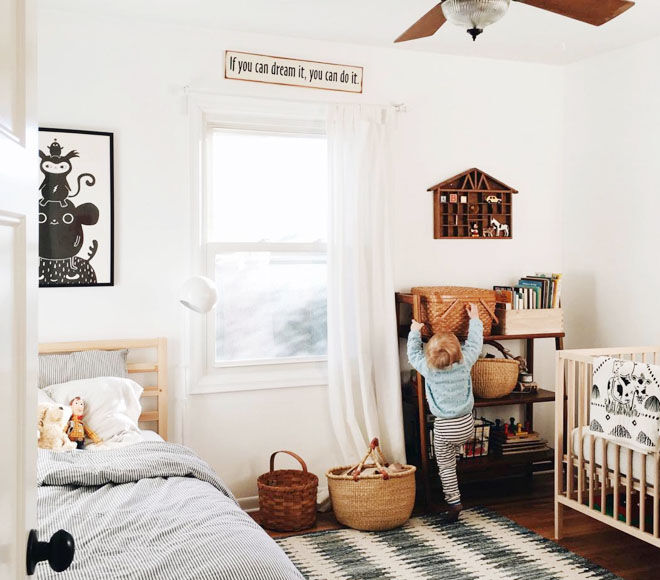 crib and toddler bed in small room