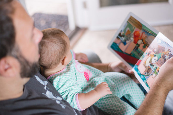Dad reading to toddler