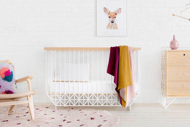 white and timber cot