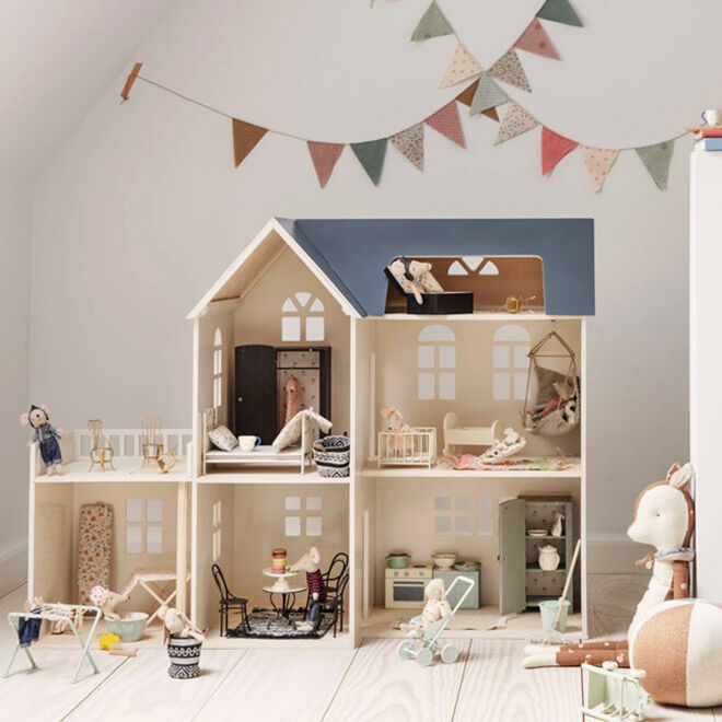 white wooden dolls house